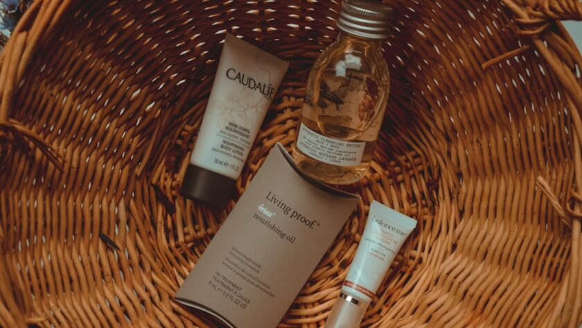 Simple Skincare Routine on a tidy bathroom counter with cleanser, moisturizer, sunscreen, and a folded towel
