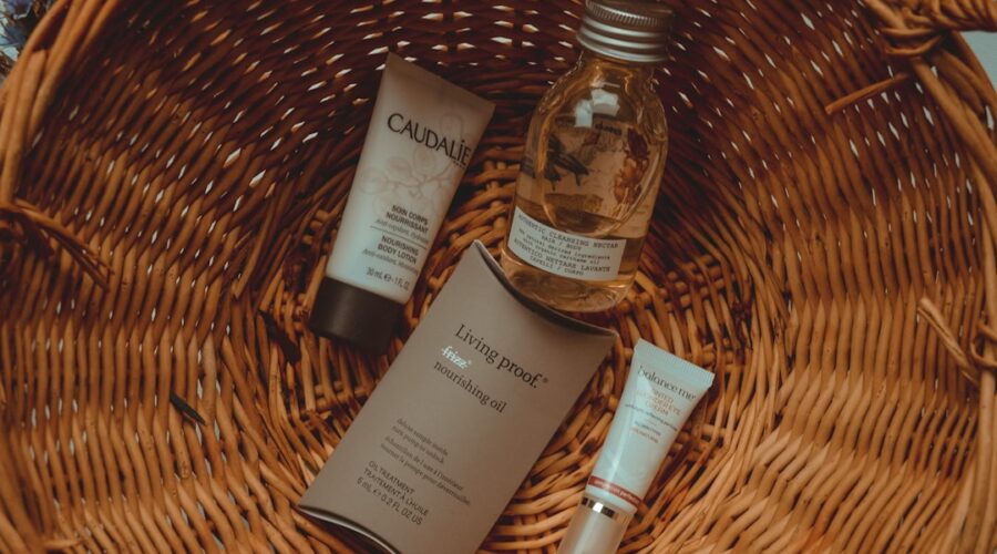 Simple Skincare Routine on a tidy bathroom counter with cleanser, moisturizer, sunscreen, and a folded towel