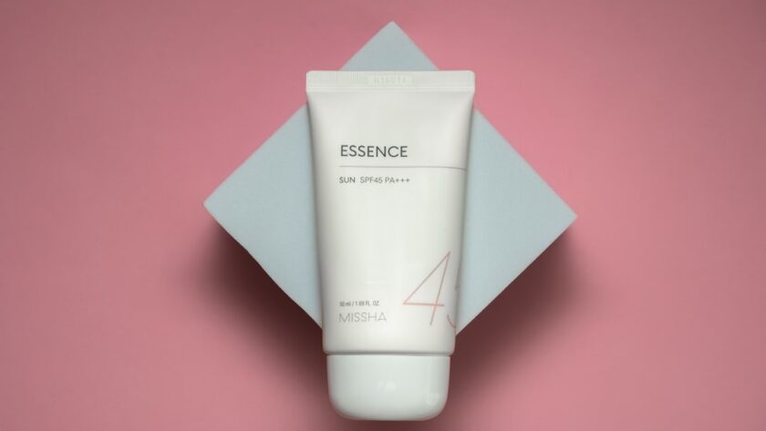 Minimalist flat-lay of cleanser, serum, cream, and sunscreen symbolizing a skin barrier care routine