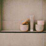 Simple Skincare Routine on a calm bathroom shelf with three core products
