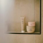 Cover illustration of a skin barrier routine with gentle cleansing, balanced moisturizers, and sunscreen