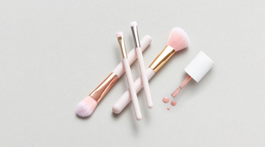 minimalist makeup routine flat lay with neutral-toned essentials